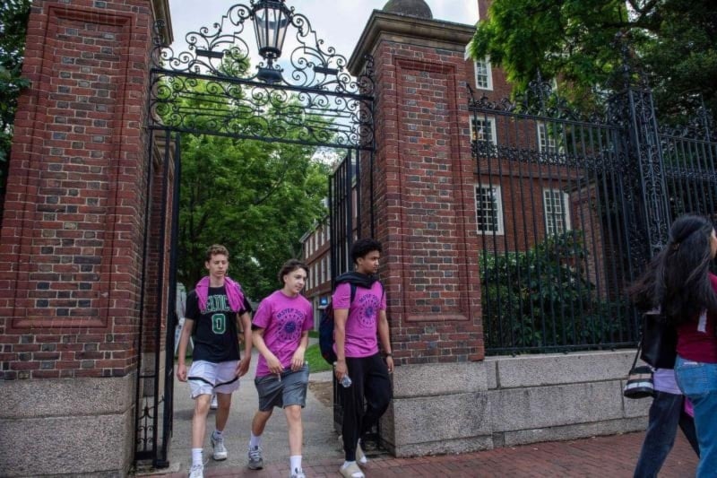 Students exit Harvard Yard in Cambridge, Massachusetts. (AFP)