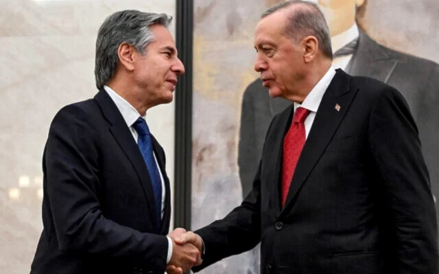 US Secretary of State Antony Blinken, left, shakes hands with Turkey's President Recep Tayyip Erodgan, during their meeting at Ankara Esenboga Airport on December 12, 2024. (AP)