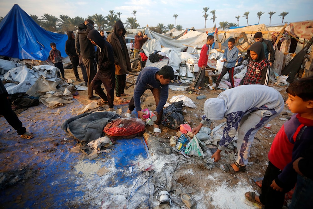  Palestnain Families check their last belongings after the Israeli airstrikes bombed their tents on December 9, 2024. (@UNRWA/ X)