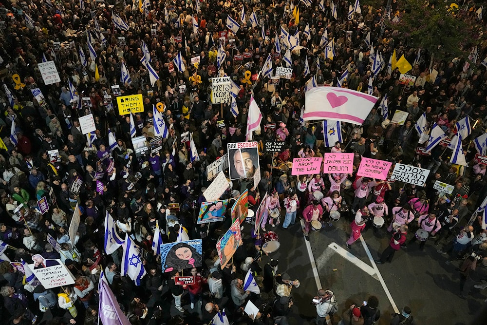 Israelis protest against Prime Minister Benjamin Netanyahu's government and call for the release of hostages held in the Gaza Strip by the Hamas militant group, in Tel Aviv, 