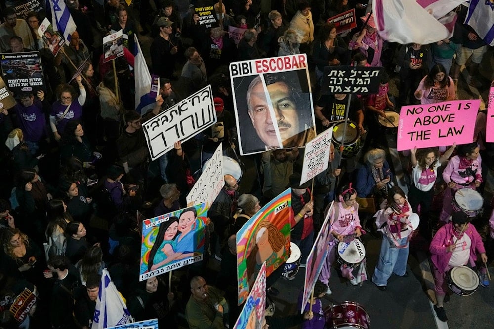 Israelis protest against Prime Minister Benjamin Netanyahu's government and call for the release of captives held in the Gaza Strip by Hamas, in Tel Aviv, occupied Palestine, Saturday, December 14, 2024 (AP)