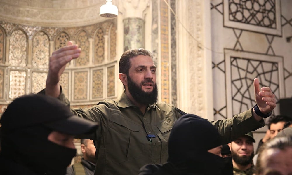 Ahmad Al-Sharaa addresses a crowd at the Syrian capital's landmark Umayyad Mosque on December 8, 2024. (AFP)