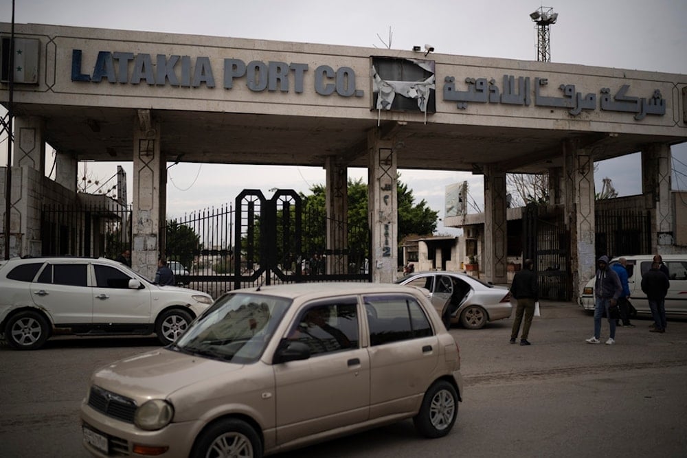 A car drives past the entrance of the port of Latakia, Syria, Monday, December 16, 2024 (AP)