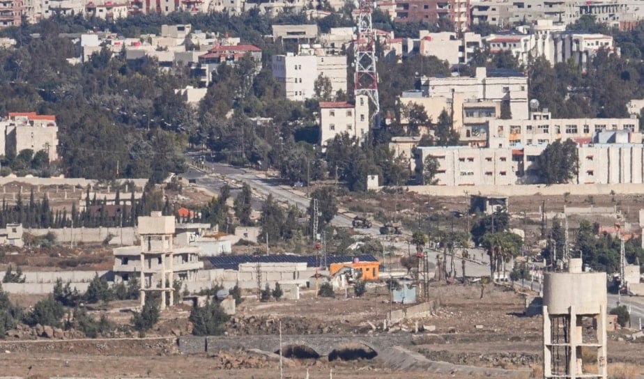 Israeli tanks park on the buffer zone after the Quneitra crossing, between Israel and Syria, are viewed from the Israeli-controlled Golan Heights, Dec. 13, 2024. (AP)