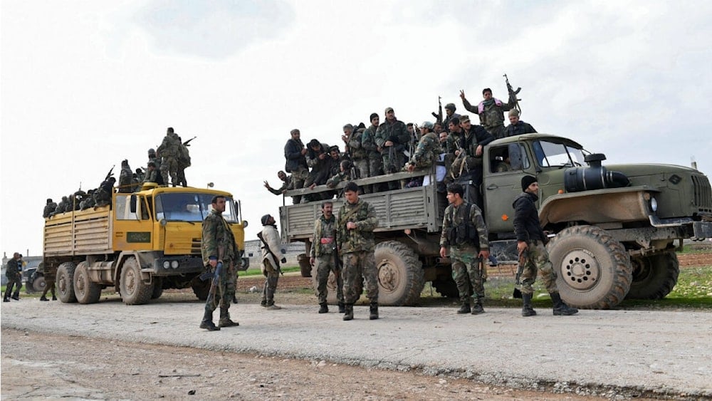 Syrian Army soldiers advance in Tall Sultan town towards Saraqeb city, in Syria's northwestern Idlib province, on February 5, 2020. (AFP)