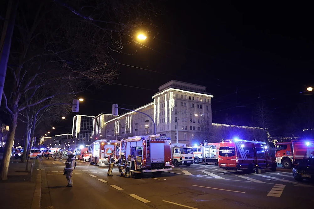 Police and ambulances next to a Christmas market where a car crashed into a crowd, injuring dozens, according to a spokesman for the local rescue service, on December 20, 2024 in Magdeburg, eastern Germany ( AFP)