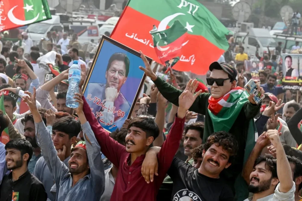  Pakistan Tehreek-e-Insaf party activists take part in a public rally on the outskirts of Lahore, Pakistan, on Sept. 21, 2024. (AFP via Getty Images)