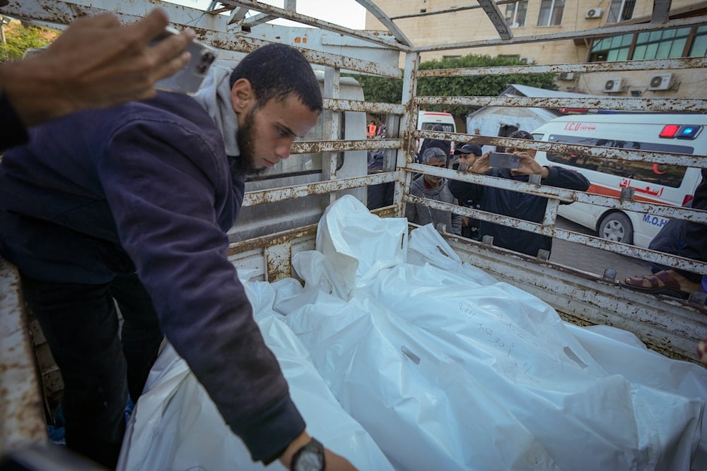 Bodies of victims of an Israeli airstrike at the Nuseirat arrive at the Al-Aqsa Martyrs hospital before their funeral in Deir al-Balah, Gaza Strip, on December 21, 2024. (AP)