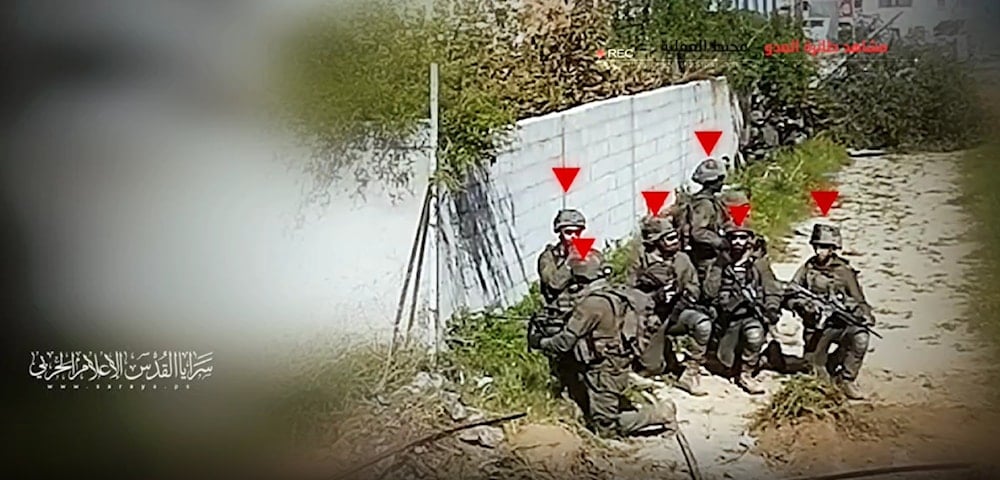 A screengrab from a video by al-Quds Brigades showing the monitoring of soldiers ahead of an operation targeting the Israeli occupation forces, Palestine, on December 22, 2024. (Military media)