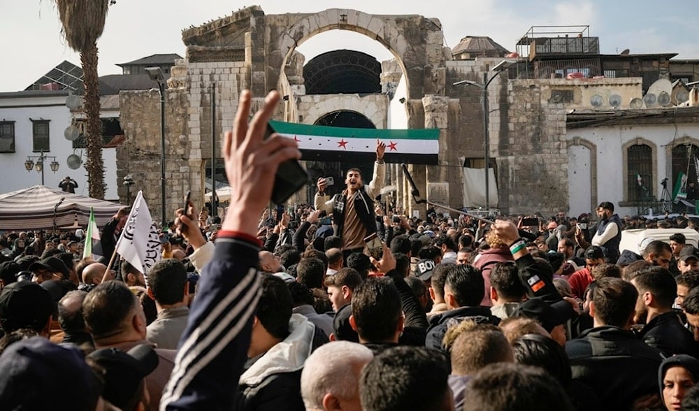  man shouts as others celebrate the fall of Bashar al-Assad's government after Friday prayers at the Umayyad Mosque in Damascus, Syria, Friday, Dec. 20, 2024. (AP)