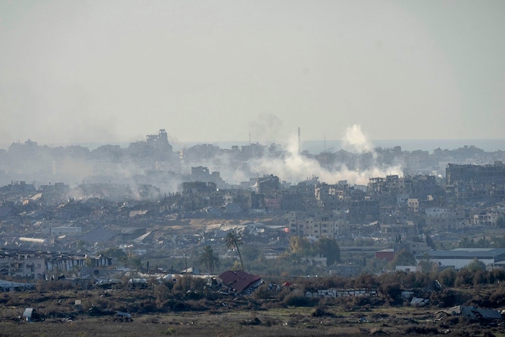 Smoke rises following an explosion in the Gaza Strip as seen from southern Palestine, Wednesday, Dec. 18, 2024. (AP Photo/Ohad Zwigenberg)