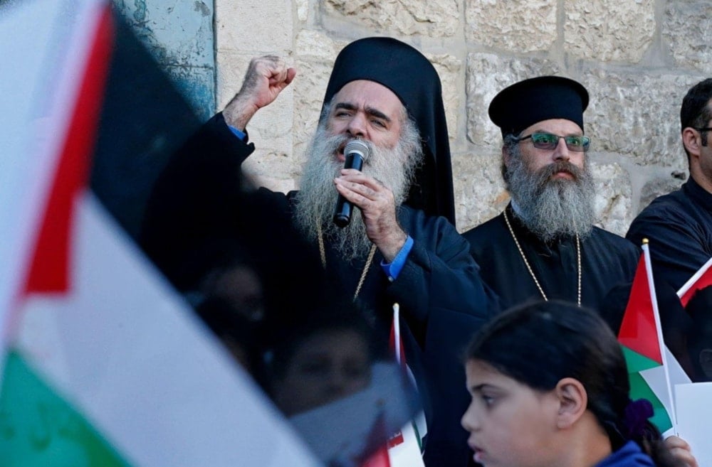 Greek Orthodox Archbishop of Sebastia in occupied al-Quds, Atallah Hanna, delivers a speech during a demonstration in Beit Jala on the outskirts of the occupied west bank city of Beit Lahm, on May 17,2021. (AFP)