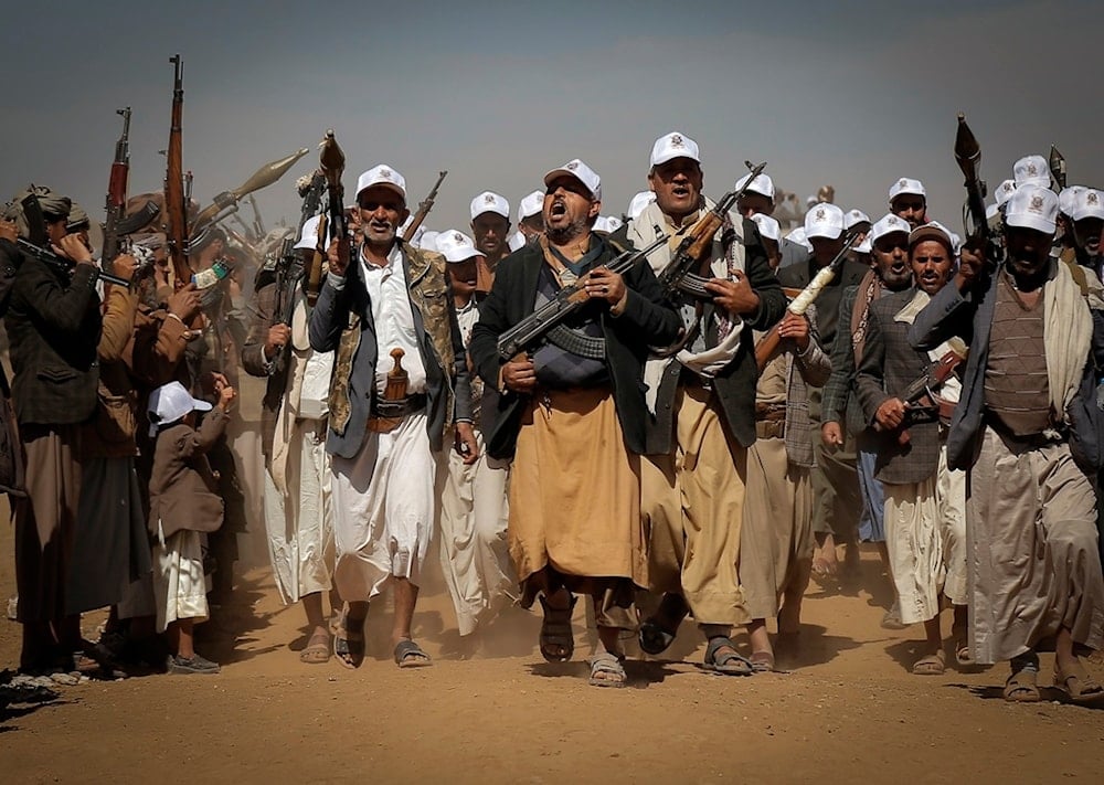 Ansar Allah fighters march during a rally of support for the Palestinians in the Gaza Strip and against the US strikes on Yemen outside Sanaa on Monday, January 22, 2024 (AP)