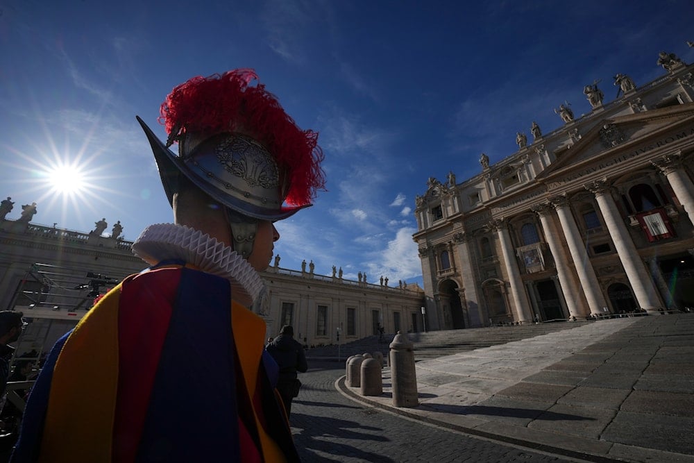 A Vatican Swiss Guard watches over St. Peter's Basilica at the Vatican, on December 25, 2024. (AP)