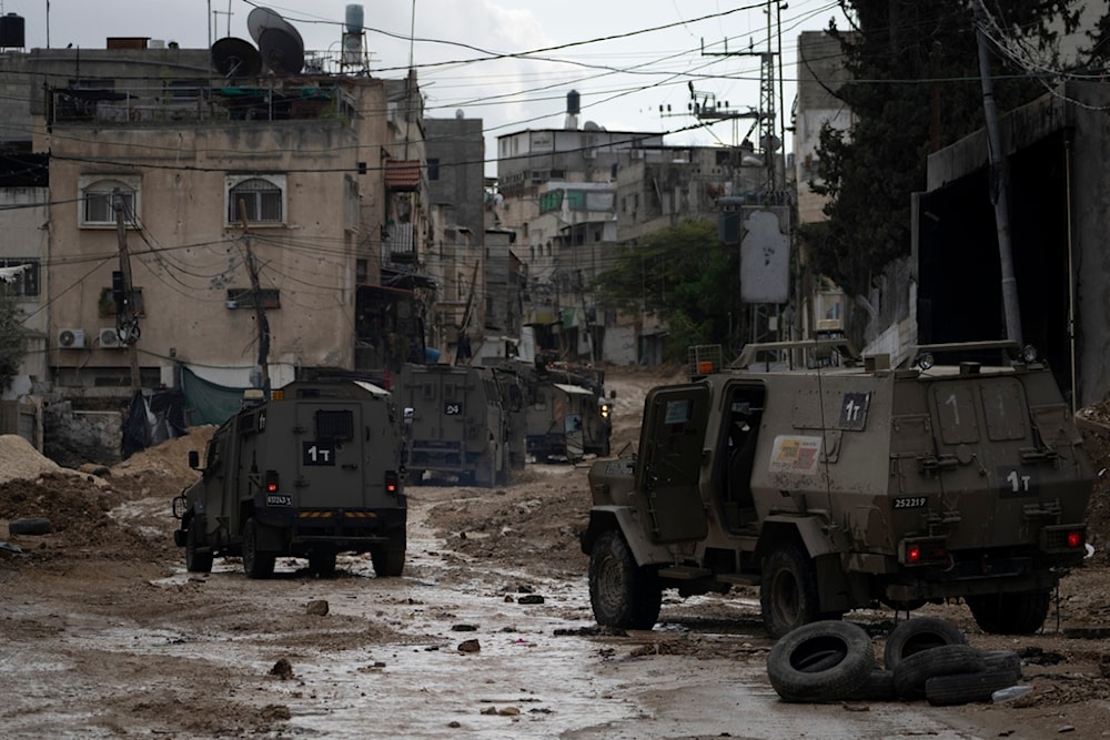 A convoy of Israeli military armored vehicles is seen during a military raid in the Tulkarem refugee camp near the West Bank city of Tulkarm, occupied Palestine , Dec. 24, 2024. (AP)