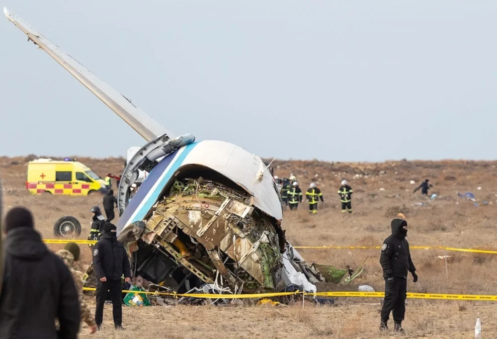 Emergency specialists work at the crash site of an Azerbaijan Airlines passenger jet near the western Kazakh city of Aktau on December 25, 2024. (AFP)