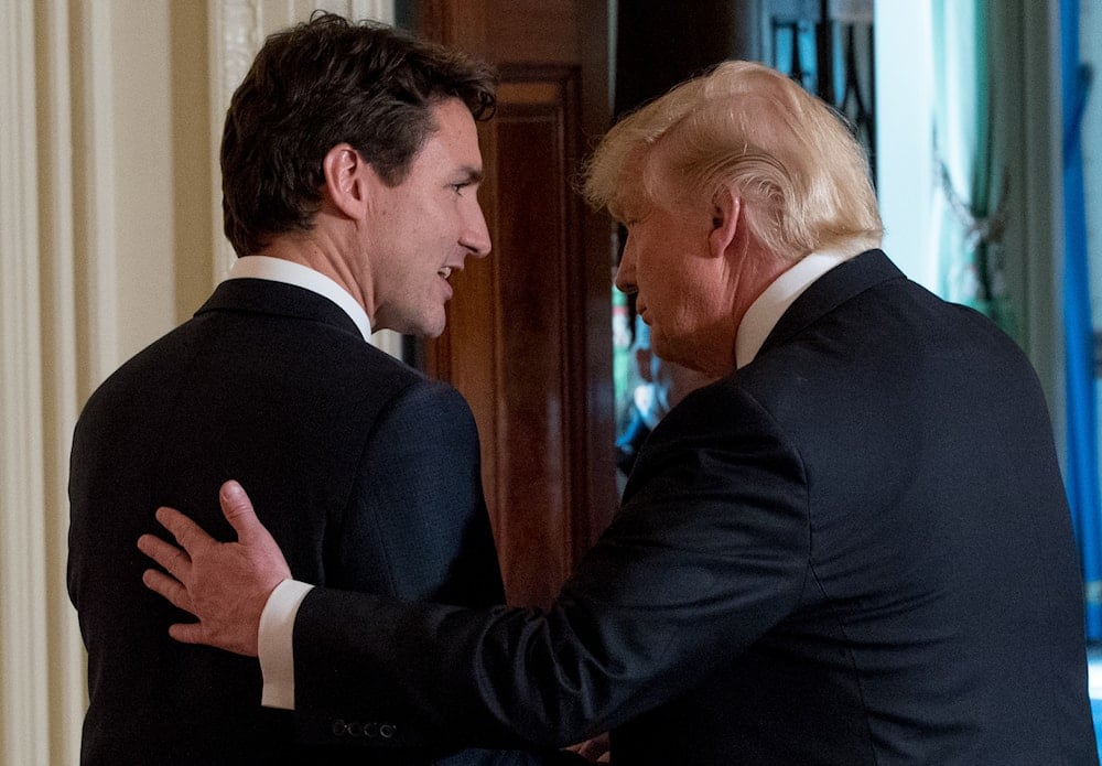 President Donald Trump, right, and Canadian Prime Minister Justin Trudeau, left, speak together as they depart a joint news conference in the East Room of the White House in Washington, on February 13, 2017. (AP)