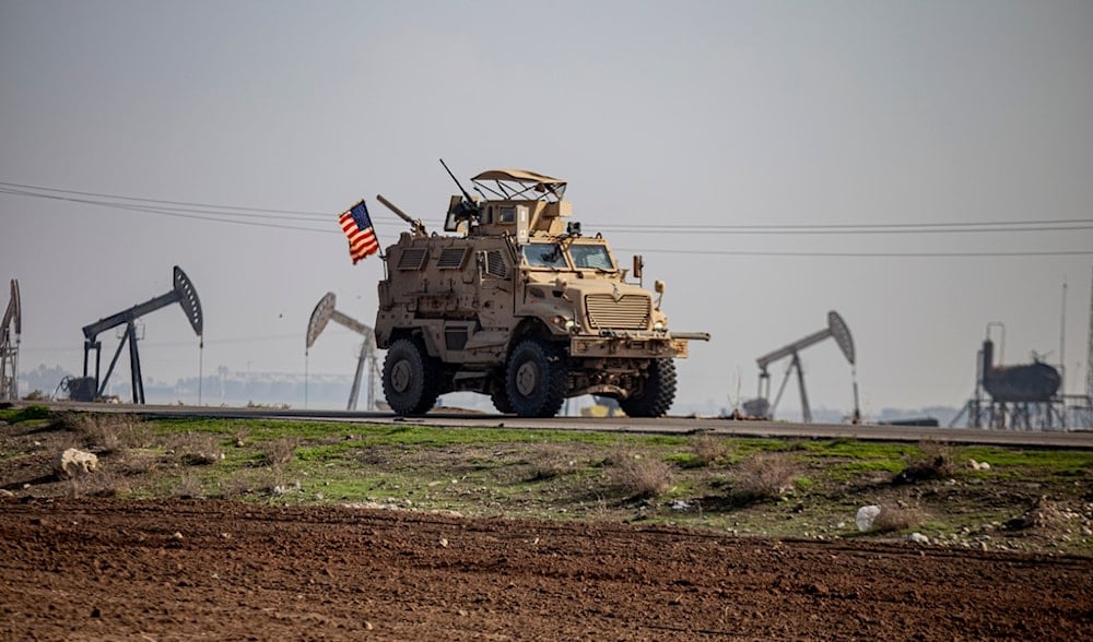 U.S. military vehicle is seen on a patrol in the countryside near the town of Qamishli, Syria, Sunday, Dec. 4, 2022. (AP)