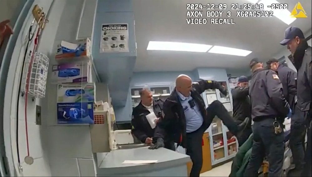 This image provided by the New York State Attorney General's office shows bodycam footage of correction officers beating a handcuffed man, Robert Brooks, 43, at the Marcy Correctional Facility in Oneida County, N.Y., on Dec. 9, 2024 (AP)