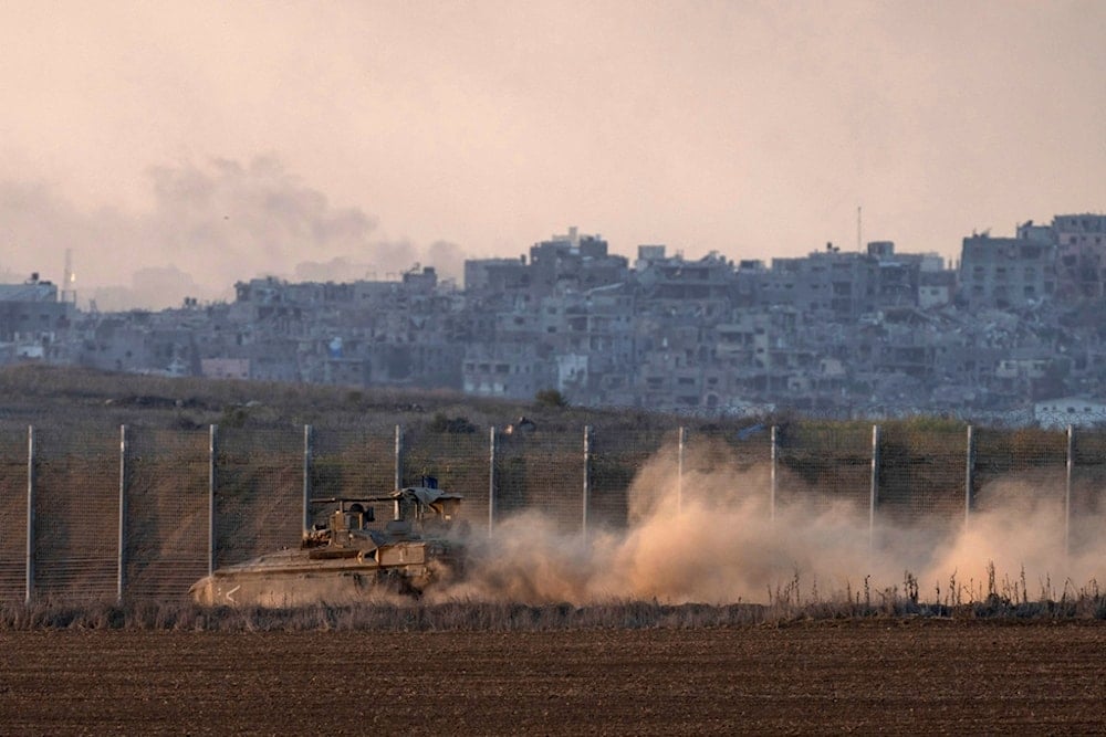 Israeli soldiers move on armored personnel carriers (APC) near the separation line with Gaza, occupied Palestine, Wednesday, Dec.18, 2024. (AP Photo/Ohad Zwigenberg)