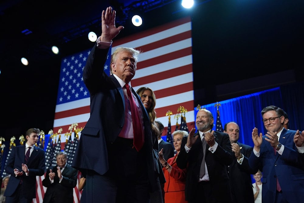 Republican presidential nominee former President Donald Trump and former first lady Melania Trump walk on stage at an election night watch party at the Palm Beach Convention Center, on November 6, 2024, in West Palm Beach, Fla. (AP)