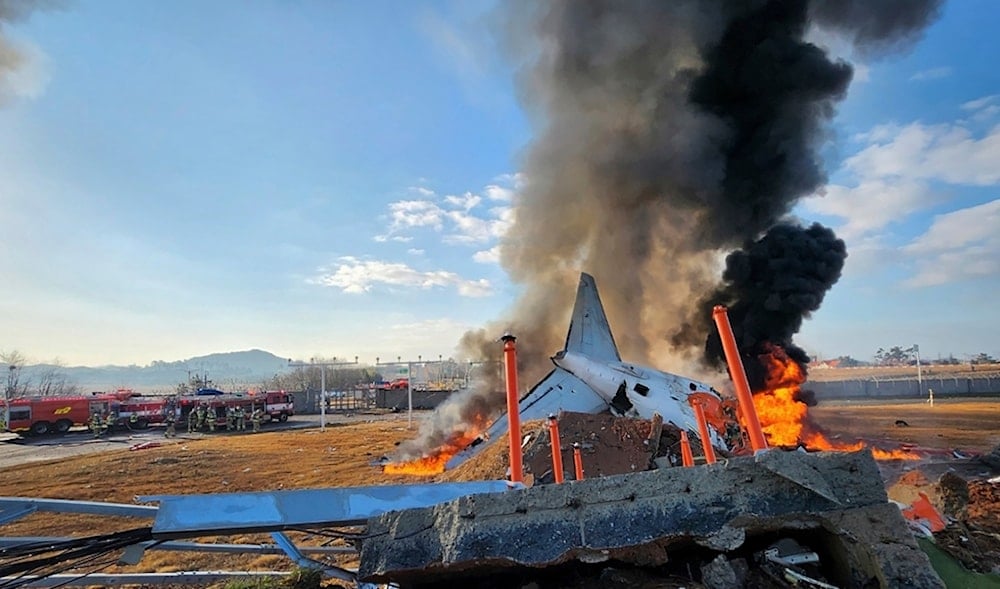 In this photo provided by South Korea's Muan Fire Station, a passenger plane is in flames at the Muan International Airport in Muan, South Korea, Sunday, Dec. 29, 2024. (AP)