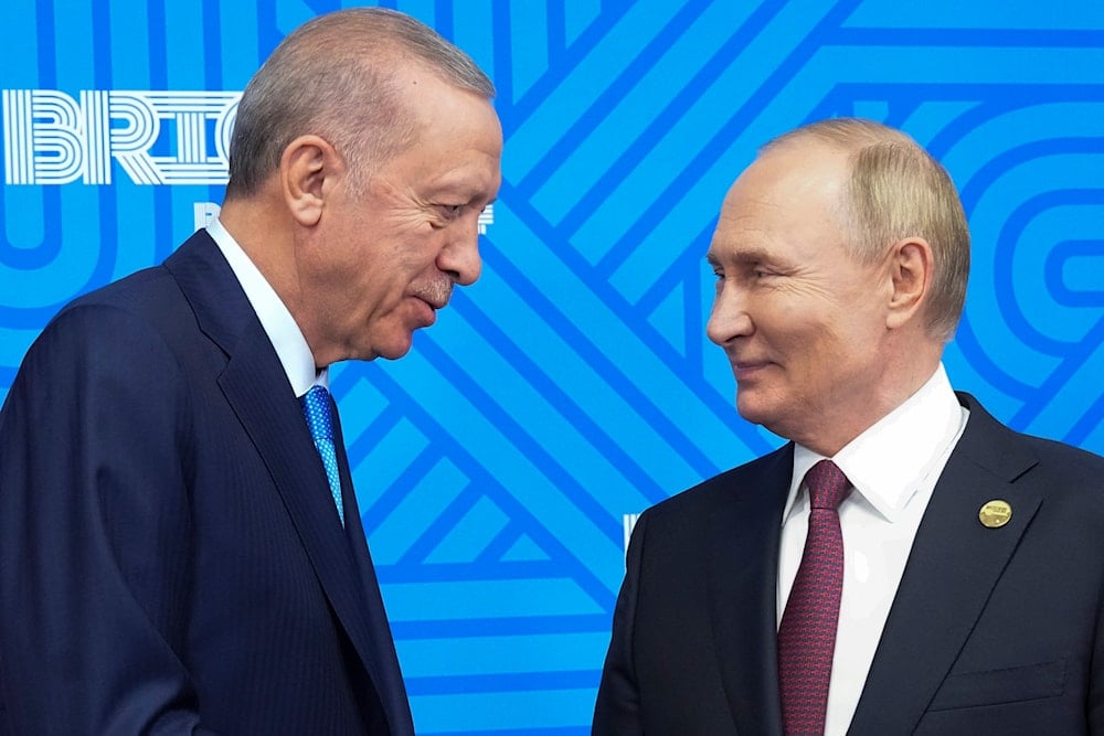 Russian President Vladimir Putin, right, meets with Turkish President Recep Tayyip Erdogan on the sidelines of the BRICS summit in Kazan, Russia, on October 23, 2024. (AP)