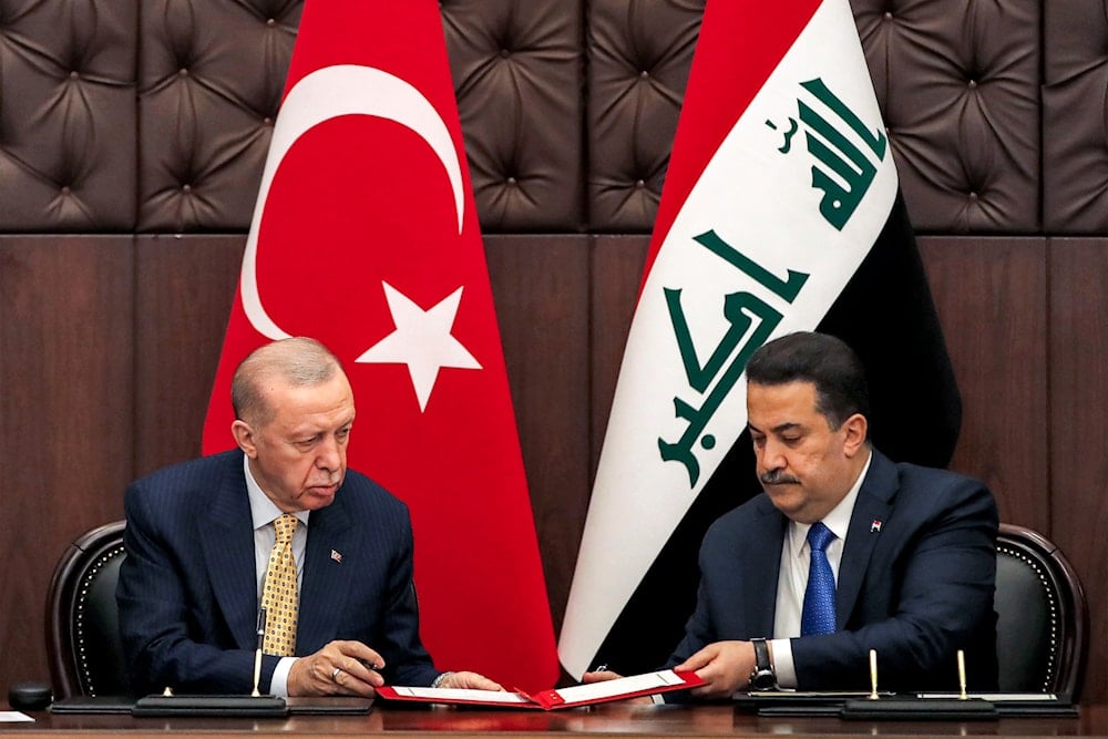 Turkish President Recep Tayyip Erdogan, left, and Iraqi Prime Minister Mohammed Shia al-Sudani exchange signed agreements during their meeting, in Baghdad, Iraq,on April 22, 2024. (AP)