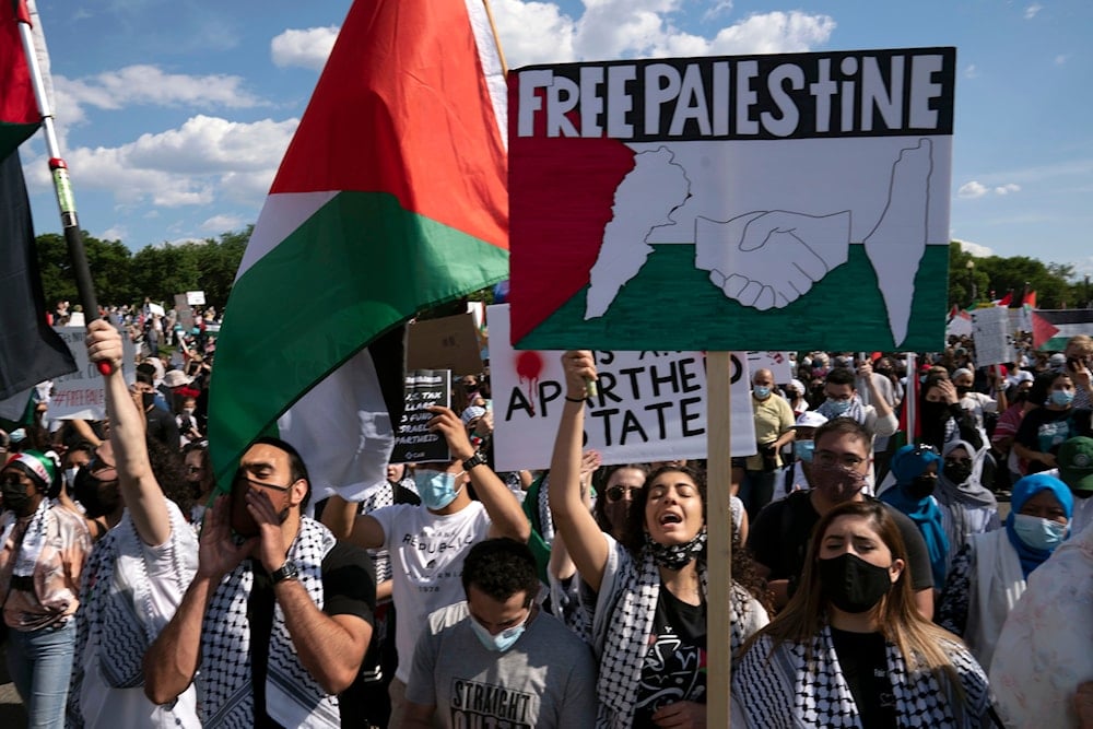 Activists supporting Palestine chants as they gather at the Washington Monument during a demonstration in Washington, on May 15. 2021. (AP)