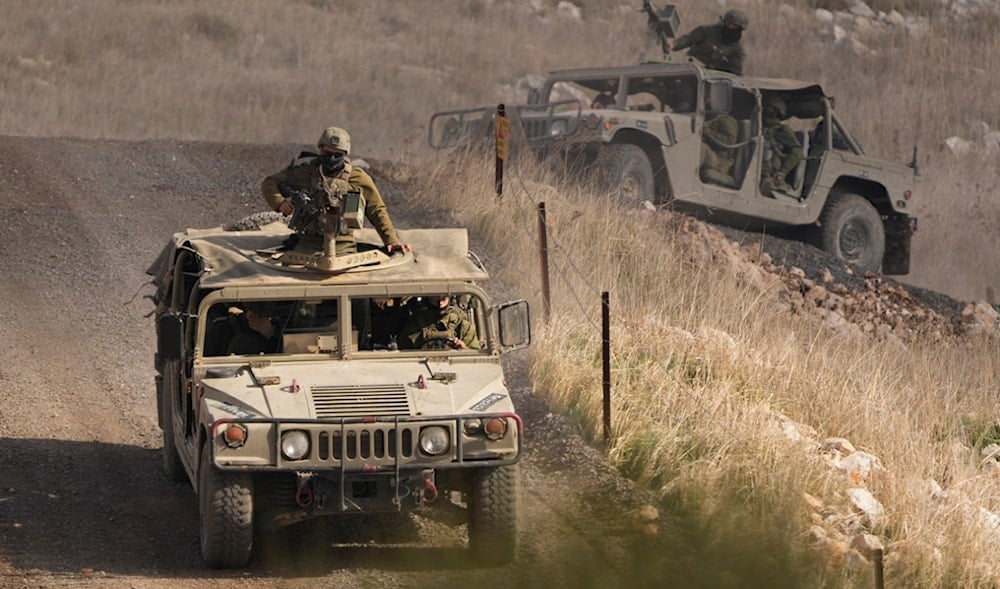 Israeli soldiers stand on armored vehicles inside the buffer zone near the so-called 'disengagement line' that separates the occupied Golan Heights from Syria, viewed from the town of Majdal Shams, Saturday, Dec. 21, 2024. (AP)