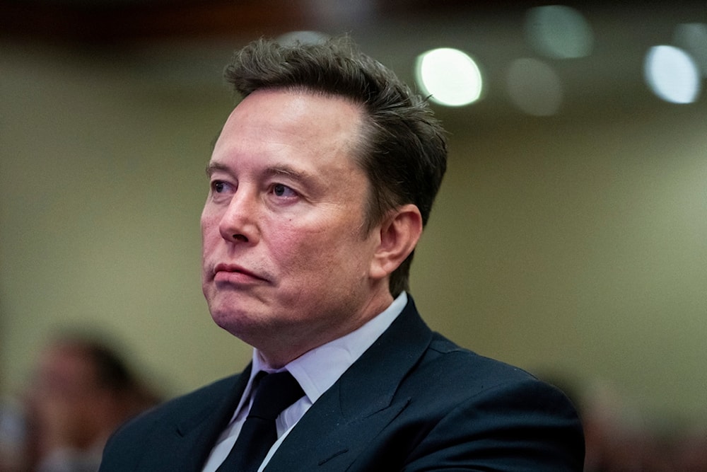 Elon Musk listens as President-elect Donald Trump speaks during a meeting with the House GOP conference, Wednesday, Nov. 13, 2024, in Washington. (AP)