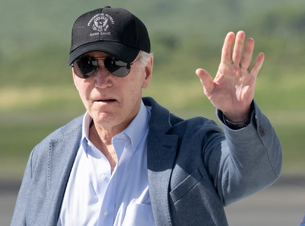 Joe Biden arrives at the airport in Christiansted, St Croix, on the US Virgin Islands, on 26 December. (AFP/Getty Images)