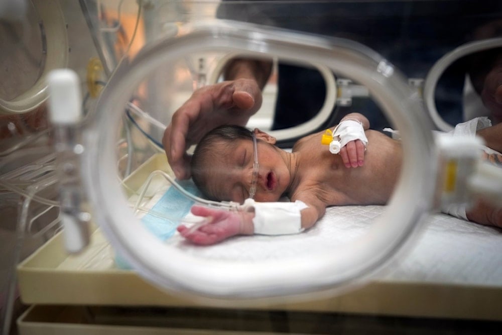 Ali al-Batran, a 20-day-old infant, lies in the intensive care unit with hypothermia at Al-Aqsa Martyrs Hospital in Deir al-Balah, central Gaza, Sunday, Dec. 29, 2024. (AP)