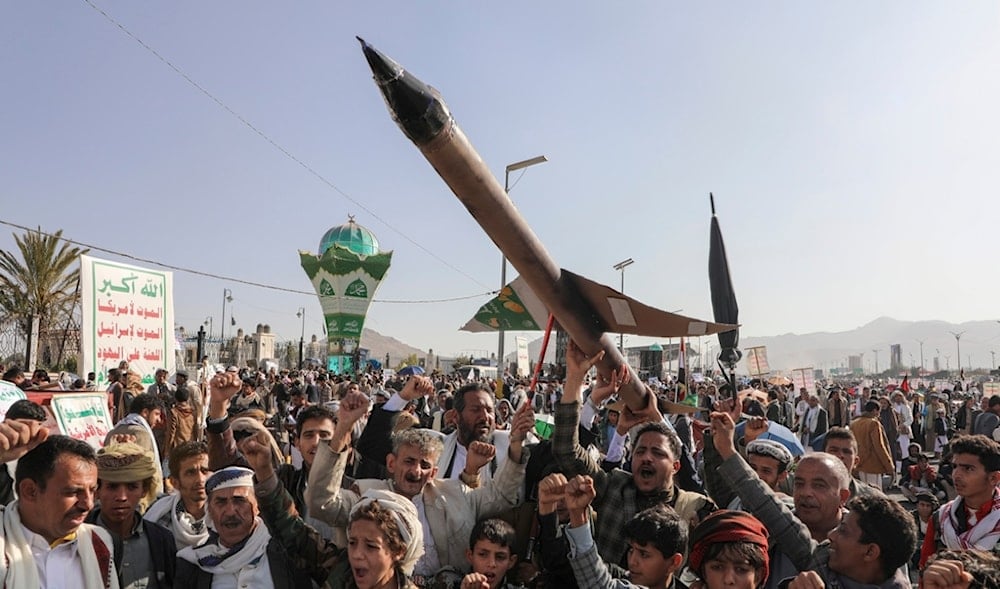 Yemenis carry a mock rocket and chant slogans during a pro-Palestine rally in Sanaa, Yemen, Friday, Dec. 27, 2024. (AP)