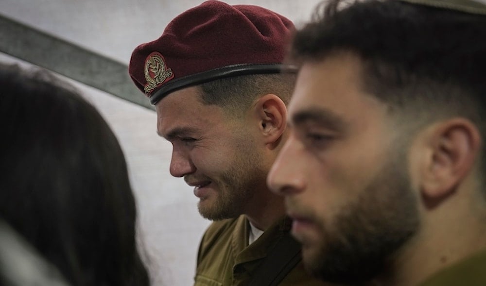 An occupation soldier cries during the funeral of combat engineer squad commander Staff Sgt. Zamir Burke, during his funeral at Mount Herzl military cemetery in occupied al-Quds, Nov. 1, 2024. (AP)