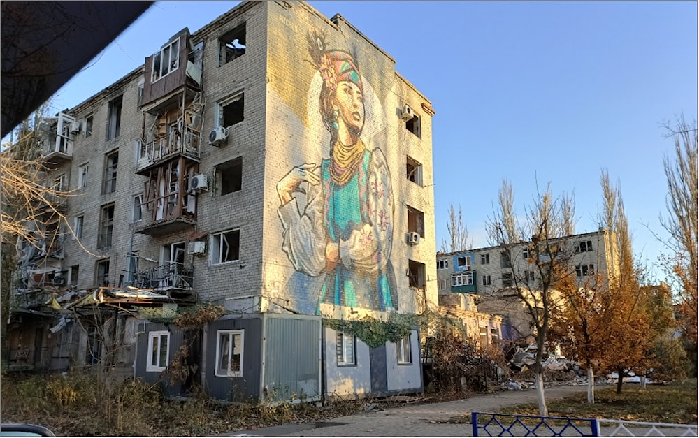 Mural on a damaged residential block, Avdeevka