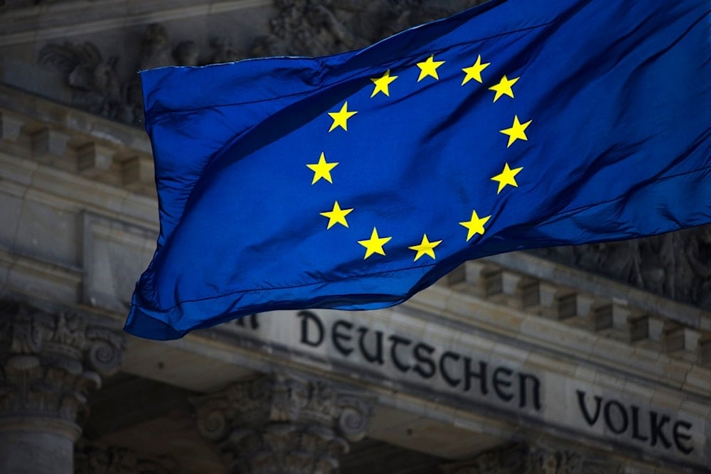 A European flag waves in front of the Reichstag building with the inscription 'Dem deutschen Volke' ('To The German People') in Berlin, Germany, Thursday, Aug. 23, 2012. (AP)