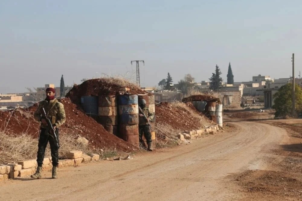 A militant stands guard in Kafr Halab, Aleppo countryside, Syria, on November 29,2024. (AP)