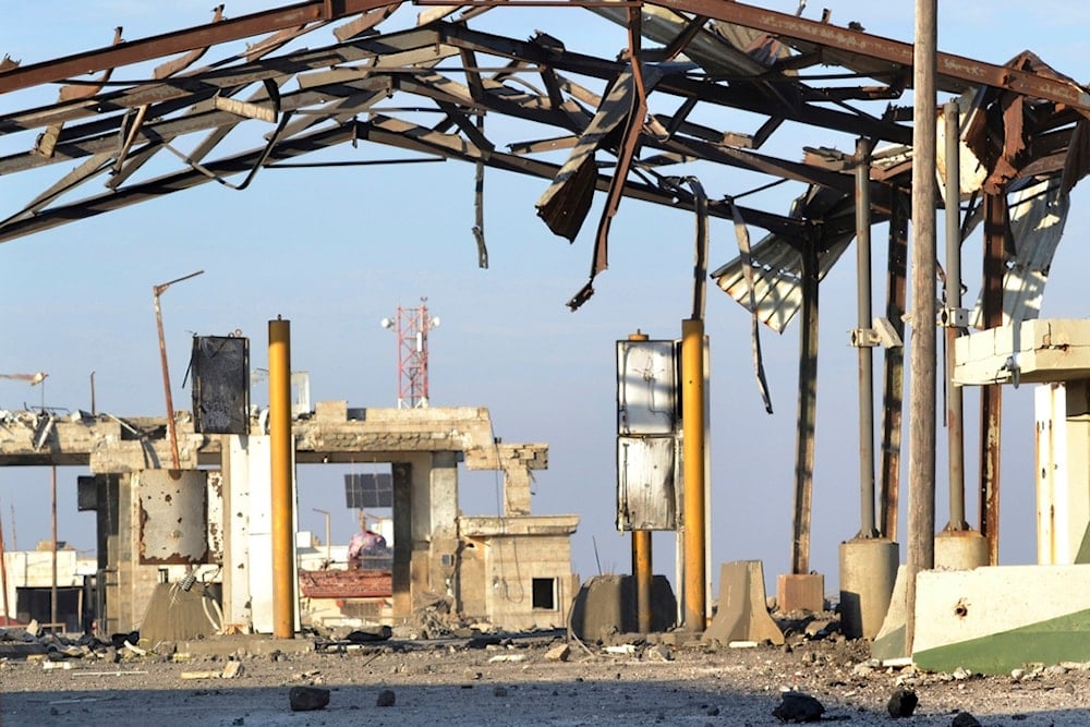 The destroyed crossing border point between Lebanon and Syria which hit by an Israeli airstrike is shown, in Arida, north Lebanon, Friday, Dec. 6, 2024. (AP Photo)