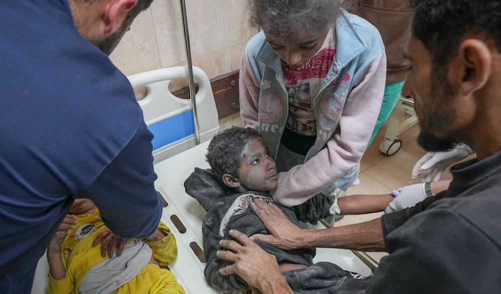 Injured children during an overnight Israeli army strike are assisted upon their arrival at the hospital in Deir al-Balah, Gaza Strip, Sunday Nov. 24, 2024. (AP)