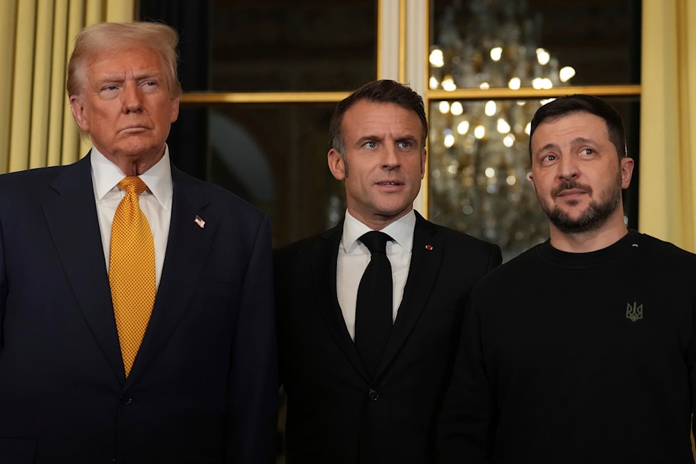 French President Emmanuel Macron, center, poses with President-elect Donald Trump, left, and Ukraine's President Volodymyr Zelensky at the Elysee Palace, on December 7, 2024 in Paris. (AP)