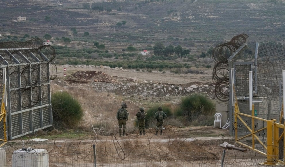 Israeli occupation forces slong a security fence gate near the so-called Alpha Line in the Israeli-occupied Syrian Golan Height, in the town of Majdal Shams, Monday, Dec. 9, 2024. (AP)