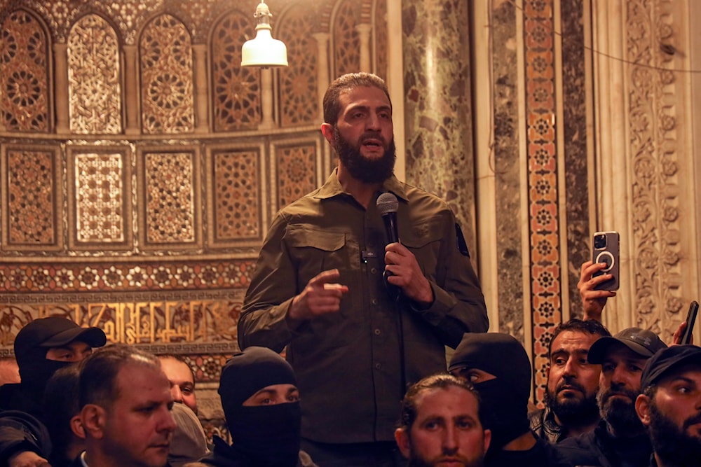 Abu Mohammed al-Golani speaks at the Umayyad Mosque in Damascus on December 8, 2024. (AP)