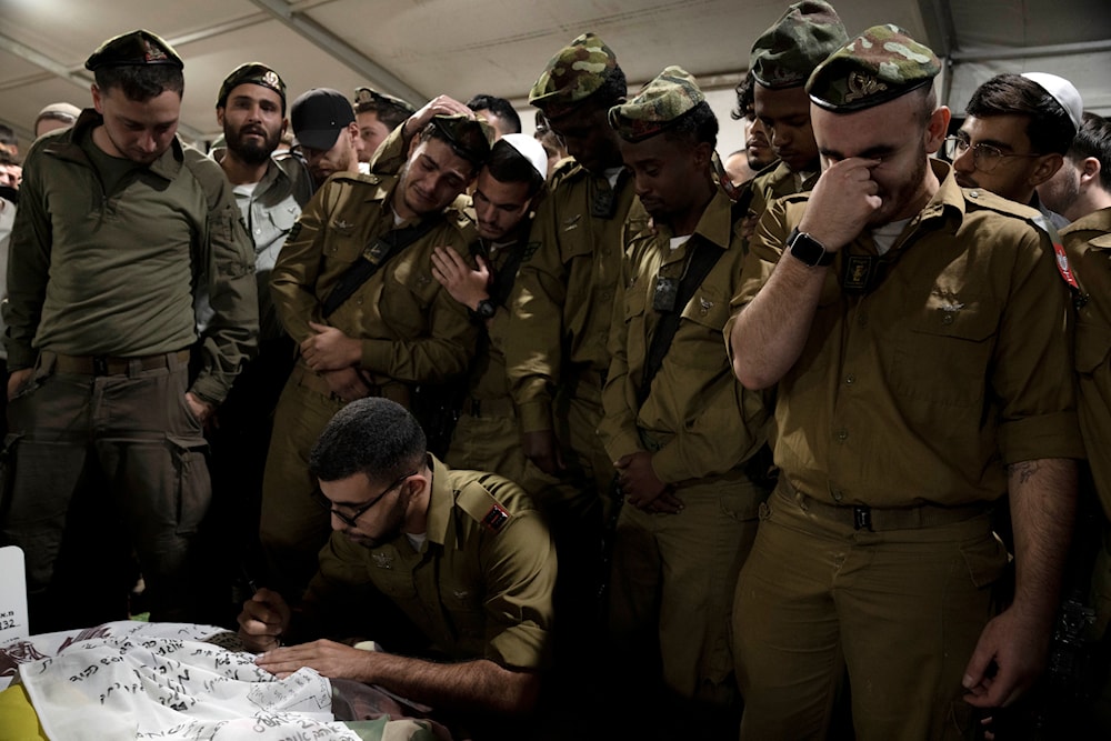 sraeli Defense Forces soldiers mourn at the grave of Sgt. First Class (res.) Roi Sasson, who was killed in action in the Gaza Strip, during his funeral at Mt. Herzl military cemetery in occupied al-Quds, Wednesday, Nov. 20, 2024. (AP)