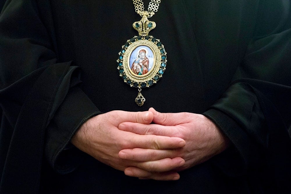 Greek Orthodox Patriarch of Antioch and all the East John X folds hands as he waits Russian Foreign Minister Sergey Lavrov for a meeting in Moscow, Russia, Tuesday, Dec. 5, 2017. (AP)