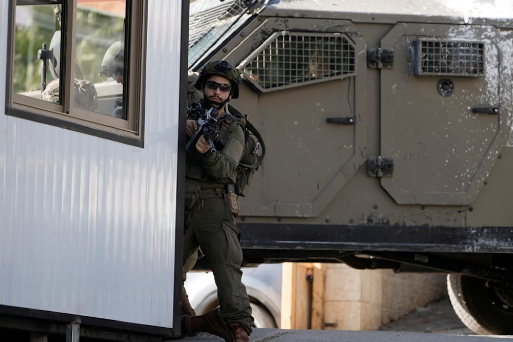 Israeli occupation forces enter the complex of the Turkish hospital, where they searched for the bodies of those killed in an airstrike, in the West Bank city of Tubas, Palestine, Dec. 3, 2024. (AP)