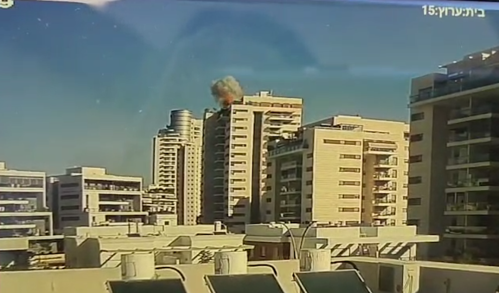 Screengrab from a video showing the moment a drone launched from Yemen exploded in a ten-story building in Yavne, Ashdod, in southern occupied Palestine, Dec. 9, 2024 (Social Media)