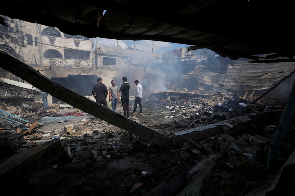 Palestinians look at the destruction after an Israeli strike on a school run by UNRWA, the U.N. agency helping Palestinian refugees, in Nuseirat, Gaza Strip, Palestine, May 14, 2024. (AP)