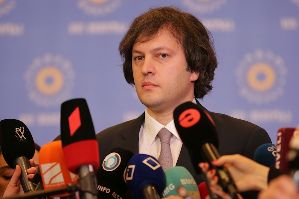 The former chairman of Georgia's ruling party Irakli Kobakhidze speaks to journalists after a meeting in Tbilisi, Georgia, February 1, 2024 (AP)