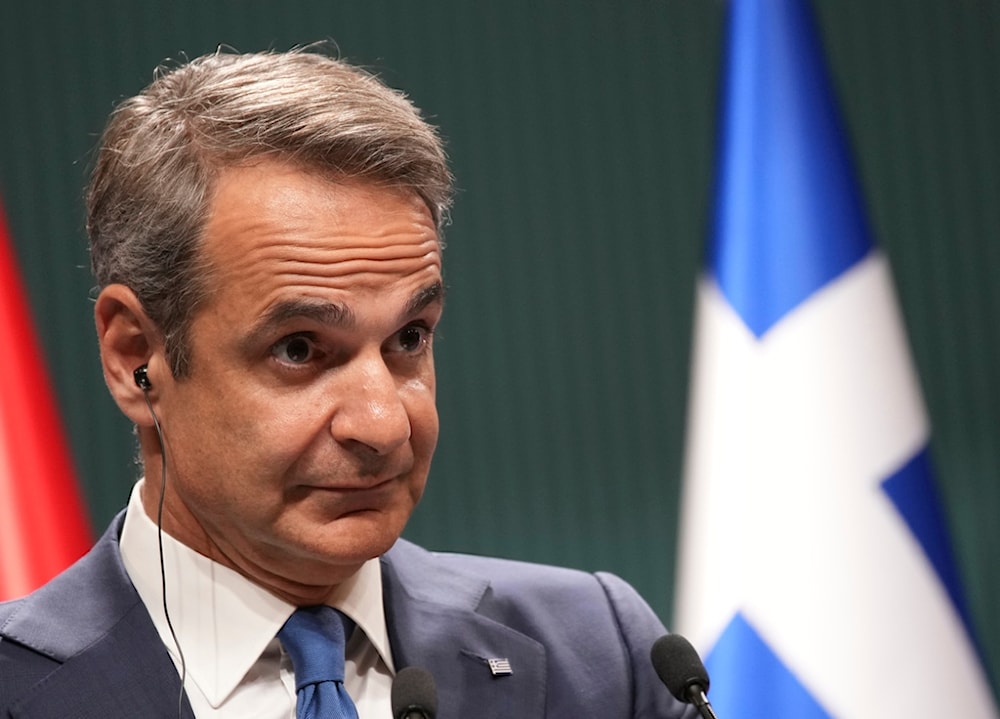 Greek Prime Minister Kyriakos Mitsotakis listens to Turkish President Recep Tayyip Erdogan during a joint news conference in Ankara, Turkey, Monday, May 13, 2024. (AP)